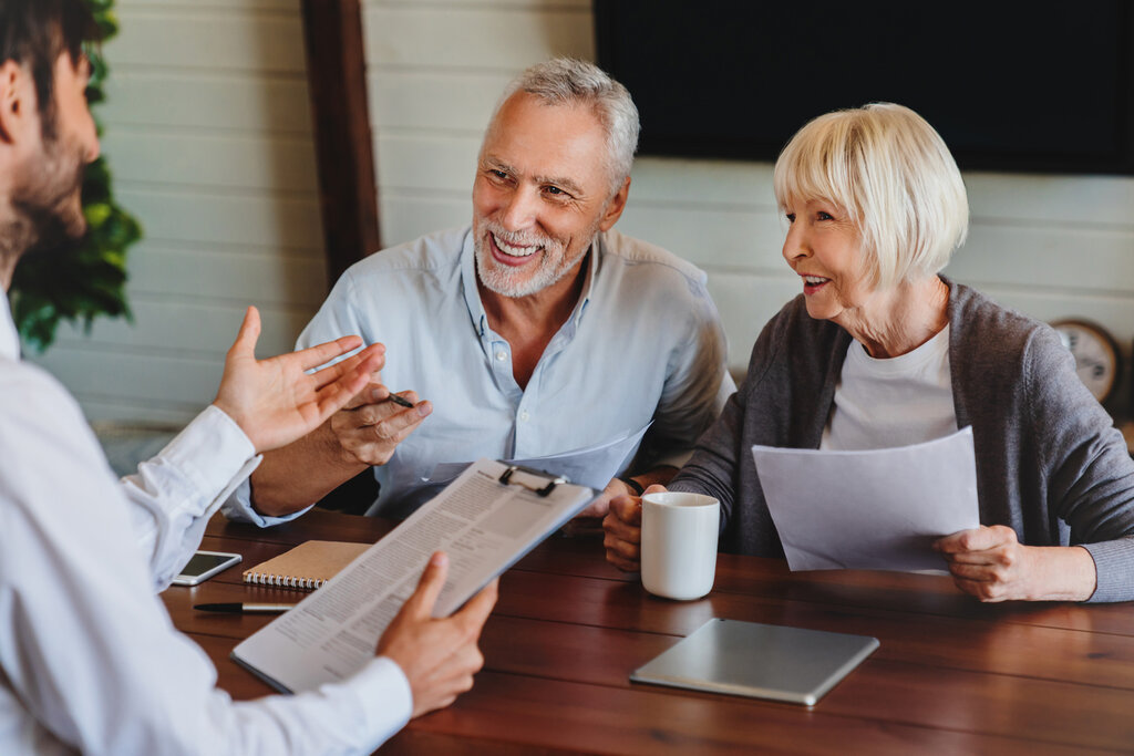 financial advisor meeting with potential clients, setting second appointment, happy retirees